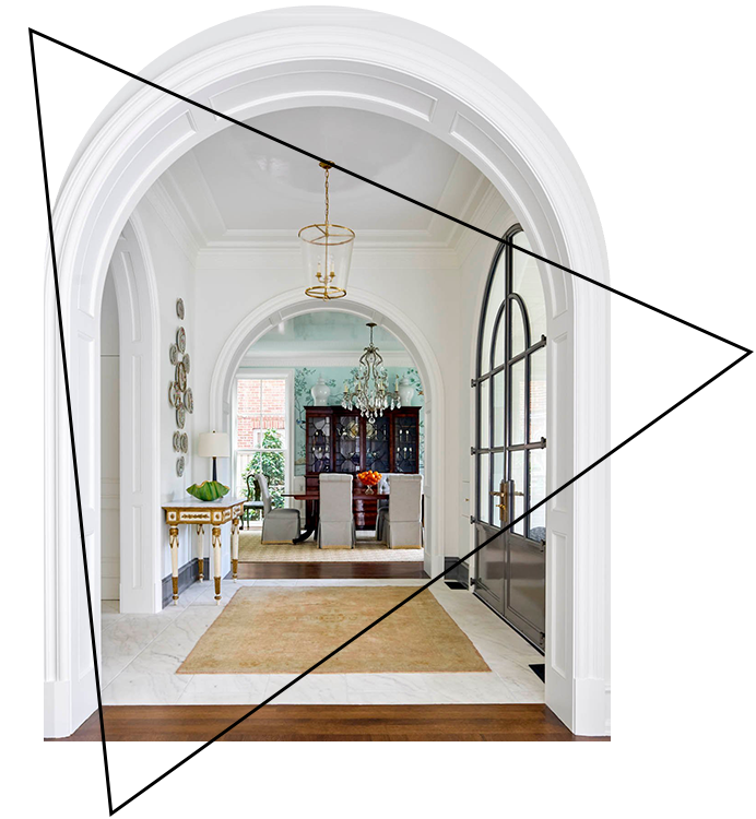 A view of an archway in the middle of a room.